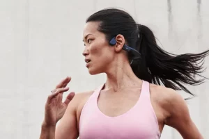 Woman running with Shokz Trekz Air on her head