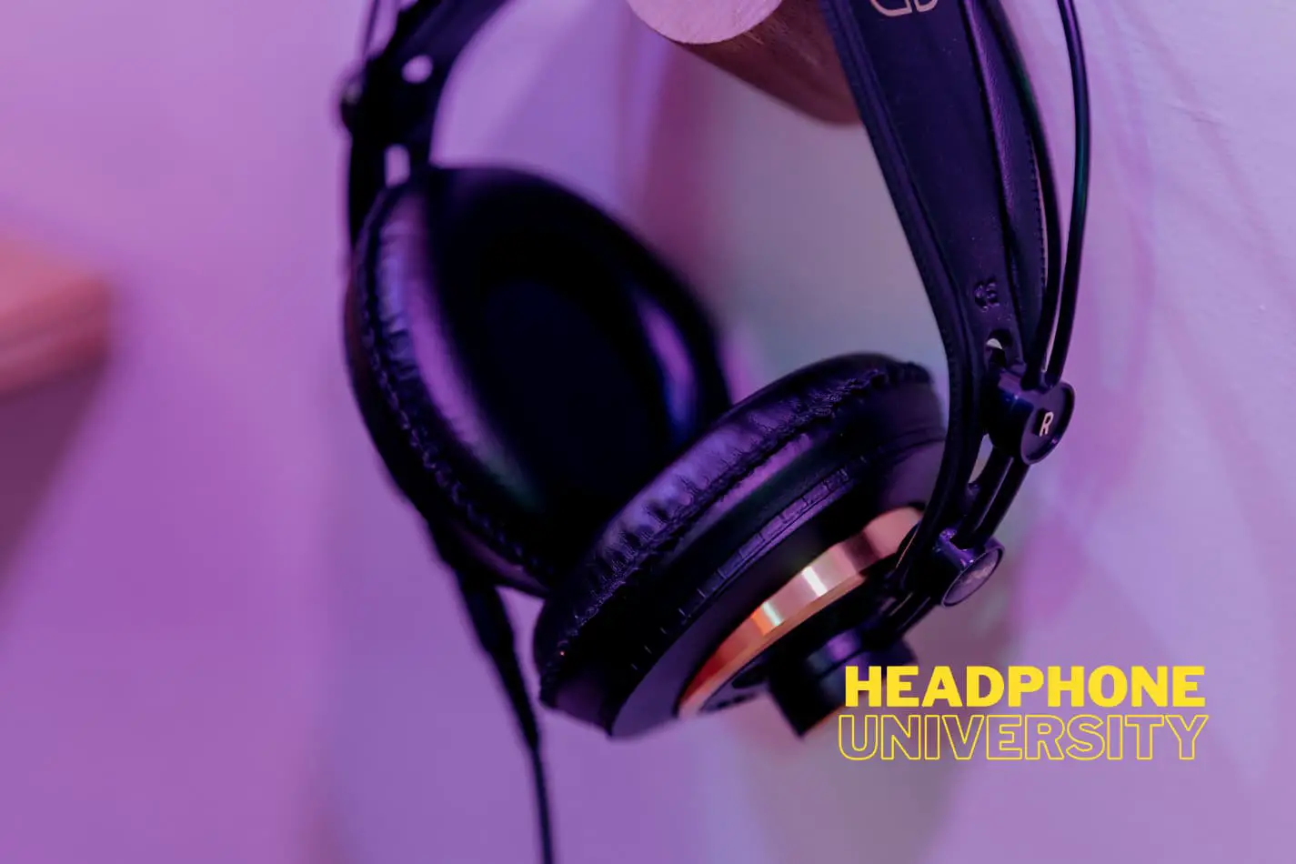 do balanced headphone cables make a difference Corded headphones hanging on a hook on the wall